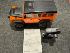 Absima CR3.4 Landi Crawler Hard Body RTR in de kleur oranje in een prima staat!