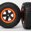Traxxas Tires & wheels, assembled, glued (SCT black, orange beadlock wheels, dual profile (2.2″ outer, 3.0″ inner), SCT off-road racing tire, foam inserts) (2) (4WD f/r, 2WD rear) (TSM rated) – TRX5863