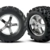 Traxxas Tires & wheels, assembled, glued (Hurricane chrome wheels, Maxx tires (6.3″ outer diameter), foam inserts) (2) (fits Revo/Maxx series) – TRX4973R