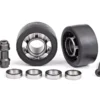 Traxxas Wheels, wheelie bar, 6061-T6 aluminum (dark titanium-anodized) (2)/ axle, wheelie bar, 6061-T6 aluminum (2)/ 10x15x4 ball bearings (4) – TRX7775A